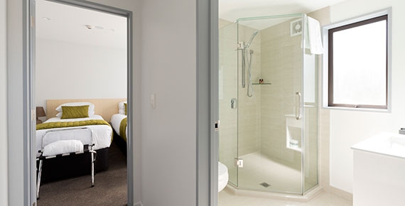 fully tiled private bathroom