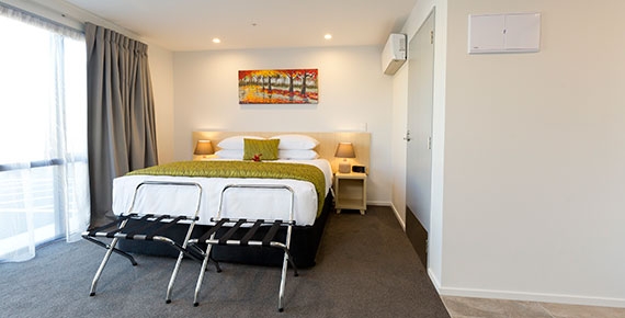 comfortable double bed and heat pump in the room